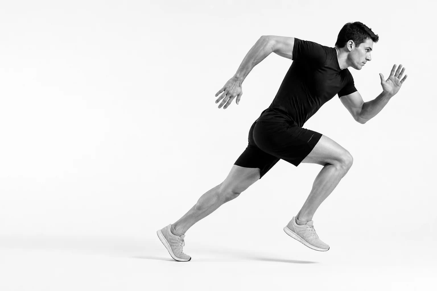 Athlete accelerating into a sprint in a bright movement studio