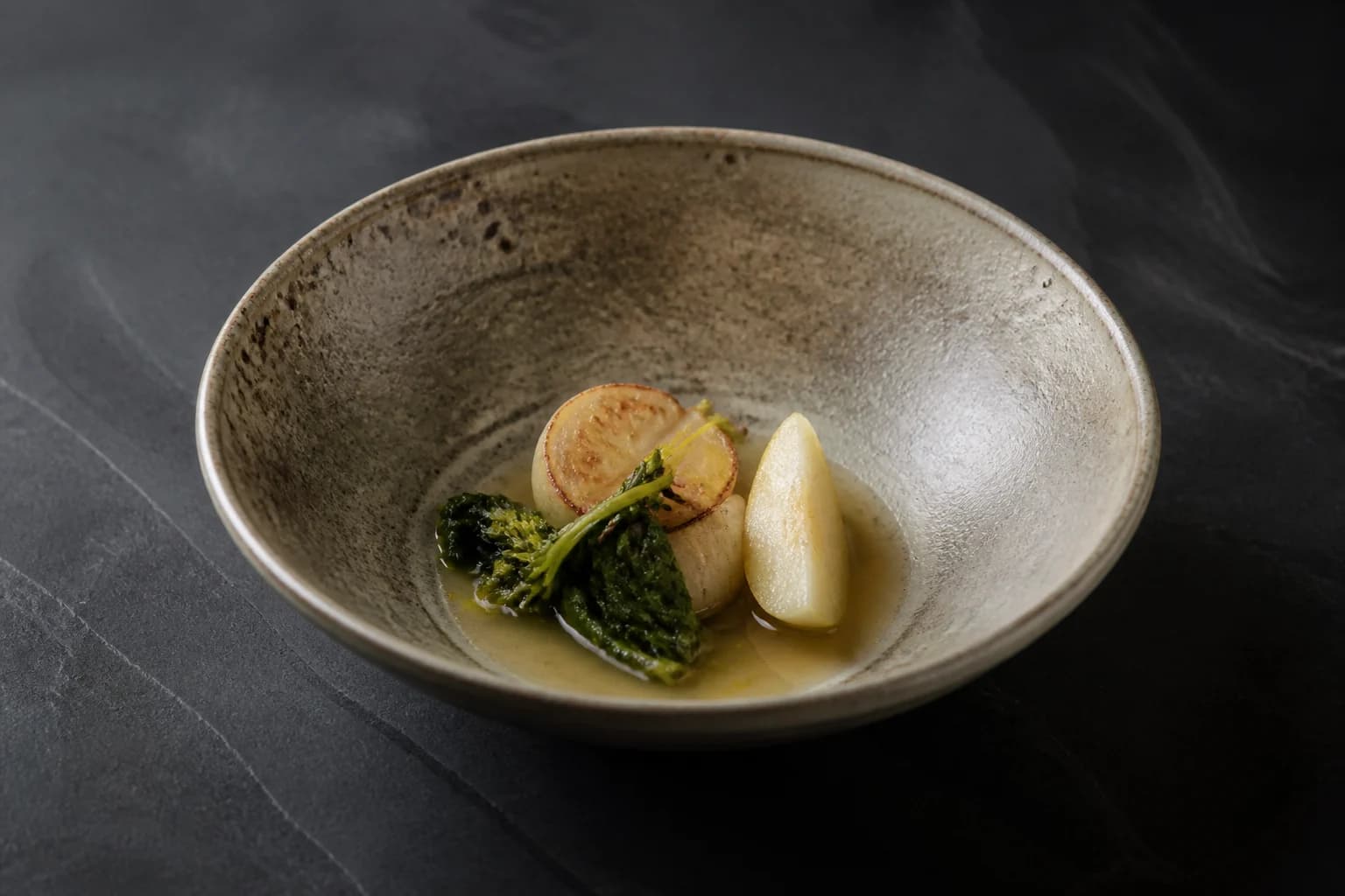 Roasted turnip, pear and mustard leaf in a handmade stoneware bowl